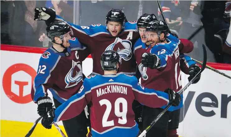  ?? — THE ASSOCIATED PRESS ?? Avalanche defenceman Erik Johnson, centre, celebrates his goal with teammates Gabriel Landeskog, left, Nathan MacKinnon, Patrik Nemeth, right, and Mikko Rantanen against the Rangers Saturday afternoon in Denver. Colorado has won eight straight homes...