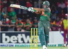  ?? — AFP ?? Shakib Al Hasan of Bangladesh hits a boundary during the second T20I match against the West Indies in Fort Lauderdale, Florida.