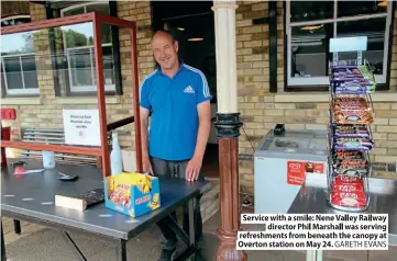  ??  ?? Servicew ith a smile: N eneV alleyR ailway
director Phil Marshall was serving refreshmen­tsfr om beneatht he canopya t Overtons tationo n May 24. GARETHE VANS