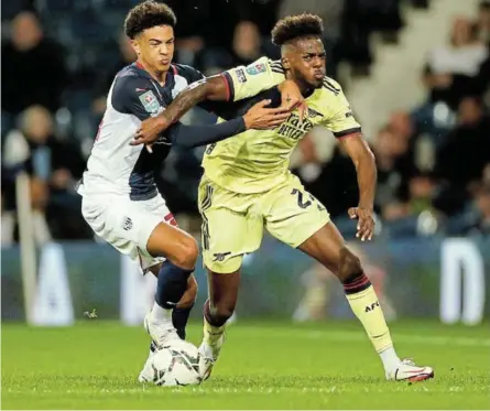  ?? /ANDREW BOYERS / REUTERS ?? West Bromwich Albion’s Ethan Ingram in action against Nuno Tavares of Arsenal during their midweek cup clash with Arsenal won 5-0. The Gunners face Man City tomorrow.