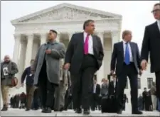  ?? JACQUELYN MARTIN — THE ASSOCIATED PRESS ?? New Jersey Gov. Chris Christie, center, leaves the Supreme Court where a case on sports betting is being heard, Monday.