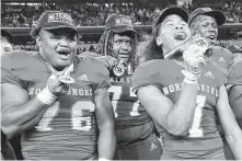  ?? Elizabeth Conley / Staff photograph­er ?? North Shore players celebrate their 17-10 win over Duncanvill­e in the 6A Division I state title game last weekend.