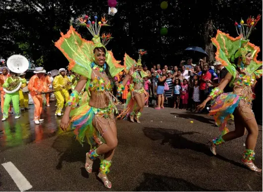  ??  ?? Revellers taking part in a street parade during the Internatio­nal ‘Carnaval’ of Victoria on Mahe island
