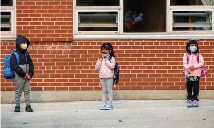  ??  ?? Students arrive for the first time since the start of the coronaviru­s pandemic at Hunter’s Glen junior public school in Ontario earlier this month. Cases have since been reported in 224 schools. Photograph: Carlos Osorio/Reuters