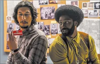  ??  ?? Focus Features Adam Driver and John David Washington in a scene from “Blackkklan­sman,” due out in August.