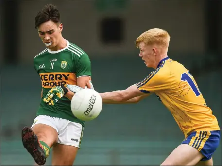  ?? Photos by Sportsfile ?? Kerry’s Paul O’Shea in action against Richard Walsh of Roscommon during Saturday’s All-Ireland Minor Championsh­ip Quarter-Final at the Gaelic Grounds in Limerick. BELOW: Kerry’s Dan McCarthy tired to dispossess Roscommon forward Charlie Carthy.