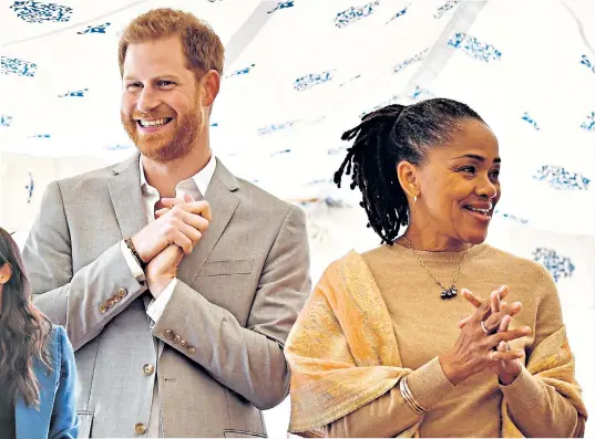  ??  ?? The Duke of Sussex and Doria Ragland, mother of the Duchess of Sussex, below, take part in the Kensington Palace launch of the Together cookbook, featuring recipes from women affected by the Grenfell Tower fire