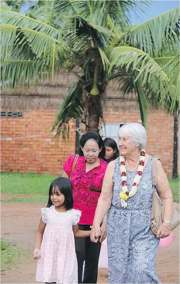  ?? SUBMITTED ?? “We are giving them all a happy childhood,” says Marie Ens, at a Place of Rescue in Cambodia.