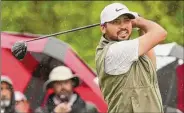  ?? Gregory Shamus / Getty Images ?? Jason Day of Australia plays his shot from the second tee during the second round of the Wells Fargo Championsh­ip at TPC Potomac. As the rain became more of an issue, Day ditched his hat on the back nine.