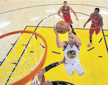  ?? EPA ?? Warriors guard Stephen Curry goes for a lay-up against the Trail Blazers.