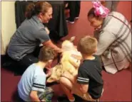  ?? BOB KEELER — DIGITAL FIRST MEDIA ?? Dr. Sharon Minninger, left, of Telford Veterinary Hospital, and children visiting Indian Creek Foundation’s Oct. 18 Foundation Fest - Community Open House, pet therapy dog Heidi.