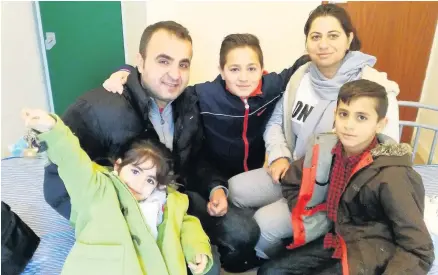  ?? Swansea Bloom ?? > Marwar, five, uncle Aram Faraj, Dani, 11, Trifa Sedeeq and Mohammed, 12. Mrs Sedeeq and her children have managed to avoid deportatio­n for the next two and a half years