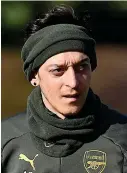  ?? GETTY IMAGES ?? Out in the cold: Arsenal’s Ozil trains yesterday