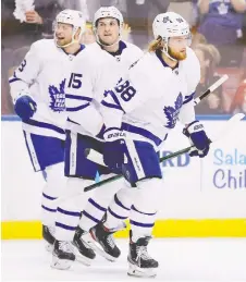  ?? MICHAEL REAVES/GETTY IMAGES ?? William Nylander, right, celebrates after scoring a third-period goal for the Maple Leafs in a gritty comeback win over the Panthers on Thursday night in Sunrise, Fla.