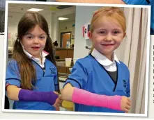  ?? ?? HEALTHY INTEREST: Fascinated school pupils learn how to use medical equipment and even put arms in slings, left