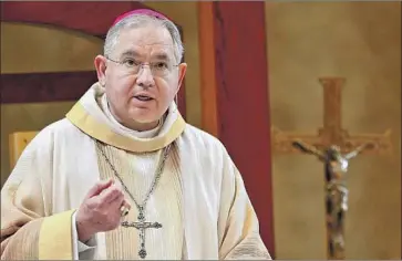  ?? Mel Melcon Los Angeles Times ?? ARCHBISHOP JOSE GOMEZ’S rise comes amid Latinos’ shifting relationsh­ip with Catholicis­m. A survey released last month found U.S. Latinos are no longer majority Catholic. Above, Gomez at a 2013 Mass.