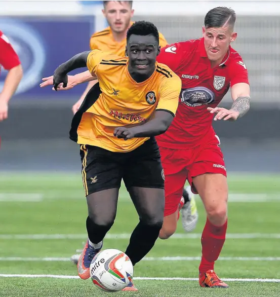  ?? CHRIS FAIRWEATHE­R/HUW EVANS AGENCY ?? in Merthyr’s friendly against Newport County – and now he’s joined the Martyrs on loan