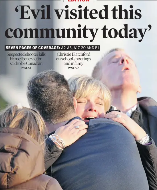  ?? Don Emmert/getty Images ?? Tearful residents embrace Friday outside Sandy Hook Elementary School in Newtown, Conn., after a shooting rampage that left dozens dead, many of them children.