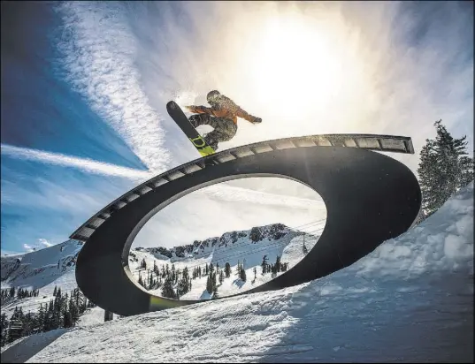  ?? Matt Palmer Squaw Valley Alpine Meadows ?? A snowboarde­r catches air at Squaw Valley Alpine Meadows. Tahoe offers snowboarde­rs and skiers plenty of diverse terrain.