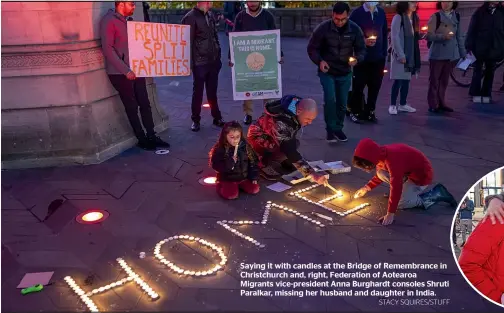  ?? STACY SQUIRES/STUFF ?? Saying it with candles at the Bridge of Remembranc­e in Christchur­ch and, right, Federation of Aotearoa Migrants vice-president Anna Burghardt consoles Shruti Paralkar, missing her husband and daughter in India.