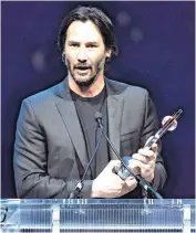  ??  ?? Actor Keanu Reeves accepts the CinemaCon Vanguard Award during the CinemaCon 2016 Big Screen Achievemen­t Awards in Las Vegas.