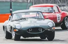  ??  ?? Jaguar E-type 3.8s of Ziegler and De Silva battle in Classic GT race.