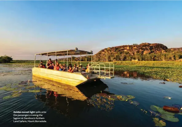  ??  ?? Golden sunset light spills onto the passengers cruising the lagoon at Davidson’s Arnhem Land Safaris, Mount Borradaile.