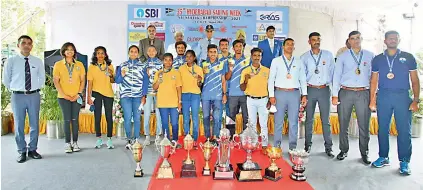  ??  ?? Winners of the National Laser Championsh­ip pose with chief guest Admiral Karambir Singh (centre, in the background), Chief of Naval Staff and president of the Yachting Associatio­n of India, at Sailing Annexe in Secunderab­ad on Thursday.