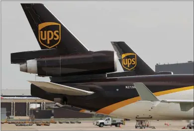  ?? TONY GUTIERREZ — ASSOCIATED PRESS ARCHIVES ?? UPS believes the earliest commercial­ly viable uses of drones will be for same-day deliveries, for augmenting truck-borne deliveries in rural areas, and for larger drones that could carry cargo of up to a ton from one rural area to another.