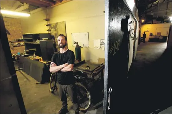  ?? Photograph­s by Luis Sinco Los Angeles Times ?? WELDER Eric Land at his space in the Naud Street warehouse. The structure had received three anonymous complaints this year, a city building official said.