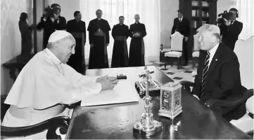  ??  ?? Francis (left) meets with Trump during a private audience at the Vatican. — AFP photo