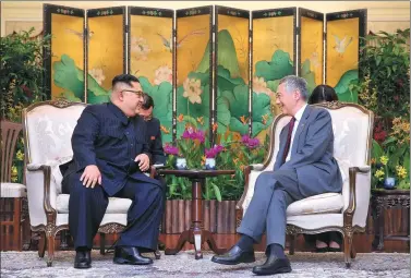  ?? PROVIDED TO CHINA DAILY ?? Kim Jong-un, top leader of the Democratic People’s Republic of Korea, and Singapore Prime Minister Lee Hsien Loong meet on Sunday.