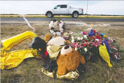  ?? DAVID BLOOM ?? A memorial marks the spot where Alex Ollington and Keithan Peters were killed in a head-on collision with a pickup truck on Highway 21 near Fort Saskatchew­an in 2020. The driver of the truck, who was impaired at the time, was sentenced on Monday to five years in prison.