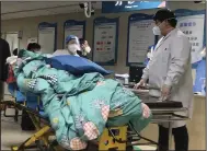  ?? (AP/Dake Kang) ?? A patient is turned away from the emergency room due to full capacity on Wednesday at the Baoding No. 2 Central Hospital in Zhuozhou city in northern China’s Hebei province.