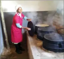  ??  ?? A local woman working in the soup kitchens, which feed 2,000 children twice daily.