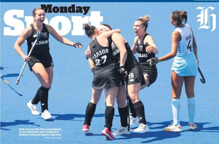  ?? Photo / Getty Images ?? Holly Pearson (No 27) is congratula­ted by her teammates after scoring New Zealand’s third goal against Argentina.
