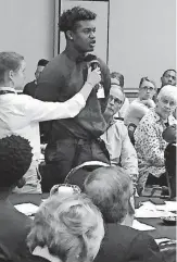  ?? [PHOTO PROVIDED] ?? College student Calvin Smith talks during a general session at the 2018 “Crossing the Bridge” social justice conference in Oklahoma City.