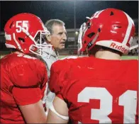  ?? MARK BUFFALO/THREE RIVERS EDITION ?? Cabot coach Mike Malham gives instructio­n to Beau Ferguson, No. 55, and Wyatt McMahan, No. 31, during the fourth quarter of Malham’s 300th win Oct. 12 when the Panthers beat Little Rock Central for the milestone victory.