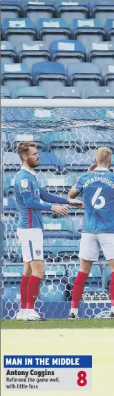  ??  ?? MAN IN THE MIDDLE Antony Coggins
Wigan Athletic celebrate after