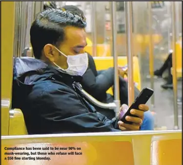  ?? (LUIZ C. RIBEIRO/FOR NEW YORK DAILY NEWS) ?? Compliance has been said to be near 90% on mask-wearing, but those who refuse will face a $50 fine starting Monday.