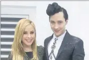  ?? Jean Catuffe Getty Images ?? FIGURE skating commentato­rs Tara Lipinski and Johnny Weir make a fashionabl­e, zingy pair.