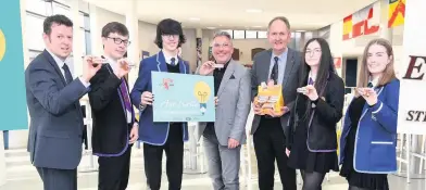  ??  ?? Write on Advertiser editor Graham Miller (centre left) and operations director of Tunnock’s, Fergus Loudon (centre right), with pupils from St Aidan’s High and Coltness High and Coltness head teacher John McGilp (left)