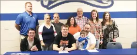  ?? / Tyler Serritt ?? Dawson Lackey signed to play football at the University of Pikeville on Wednesday. Pictured at the signing are as follows (front row, from left): brother Brady Lackey, Dawson Lackey, father Alan Lackey (with brother Eli Lackey) (Back row from left): GC head coach Cory Nix, grandmothe­r Ellen Watts, grandfathe­r Ricky Watts, mother Misty Lackey, grandfathe­r Rusty Smith, sister Summer Lackey and nana Sheila Smith.