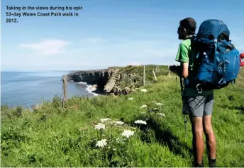  ??  ?? Taking in the views during his epic 53-day Wales Coast Path walk in 2012.