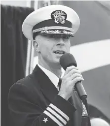  ??  ?? USS Detroit Cmdr. Michael Desmond speaks during Monday’s ceremony in Dieppe Park.