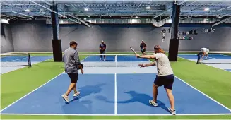  ?? Christian Abraham/Hearst Connecticu­t Media file photo ?? Pickleball America celebrates its opening with a ribbon-cutting ceremony as well as activities for players and non-players alike at Stamford Town Center on Sept. 21, 2023.