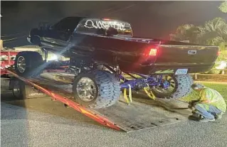  ?? DAYTONA BEACH SHORES POLICE STATIONS ?? About 46 trucks were towed over the weekend during an unauthoriz­ed truck meetup that attracted hundreds of enthusiast­s, Daytona Beach police said.