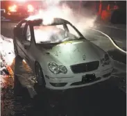  ?? Vacaville Police Department ?? This white Mercedes, spray-painted with the letters “KKK” on the passenger-side doors, was set ablaze.