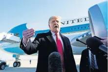  ??  ?? President Donald Trump speaks to the media Tuesday before boarding Air Force One at Andrews Air Force Base, Md. The President is traveling to Texas. [ALEX BRANDON/ THE ASSOCIATED PRESS]