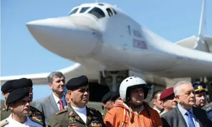 ??  ?? The Venezuelan defence minister, Vladimir Padrino López, second left, is pictured after the arrival of two Russian Tupolev Tu-160 long-range heavy supersonic bombers in Caracas. Photograph: Federico Parra/AFP/Getty Images